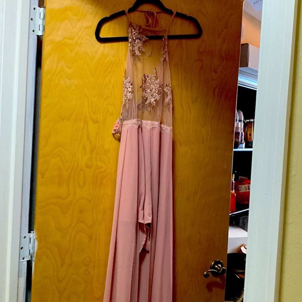 Pink romper shorts with fabric that make it turn into a long dress